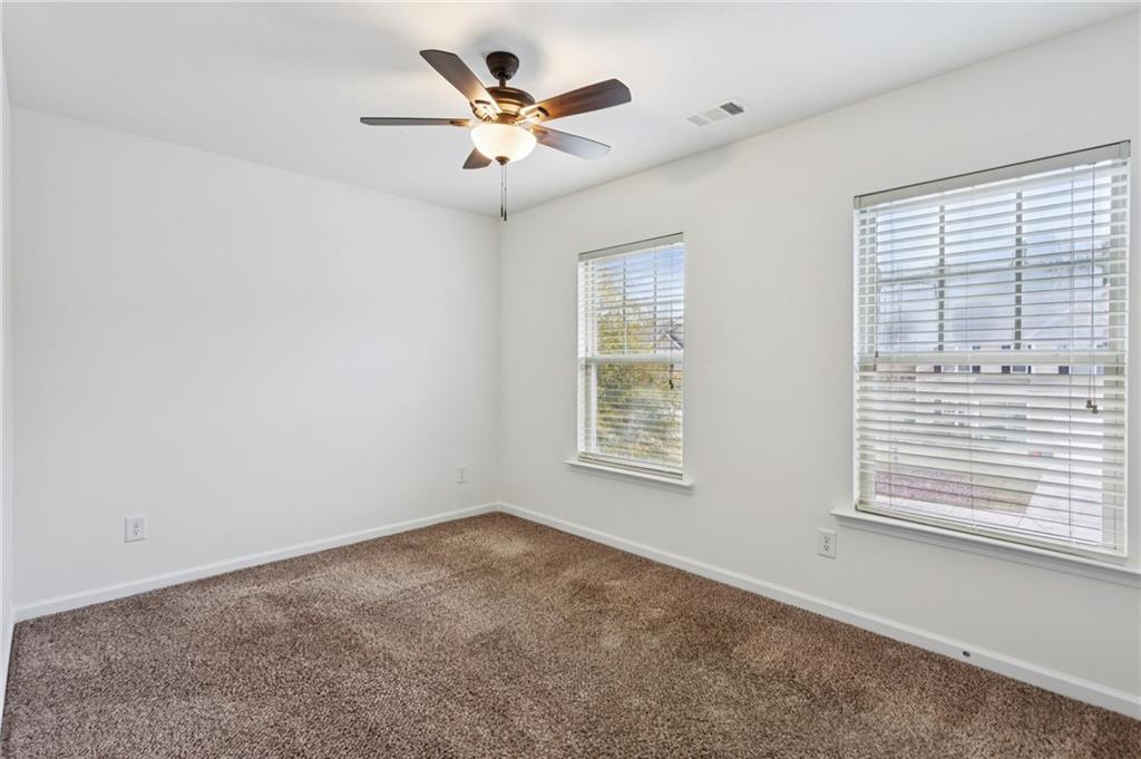 312 Upper Pheasant Court Ball Ground, GA 30107 - Photo 16 of 19 an empty room with a window