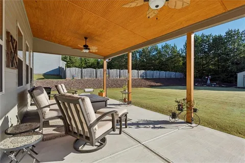 a view of swimming pool with seating space