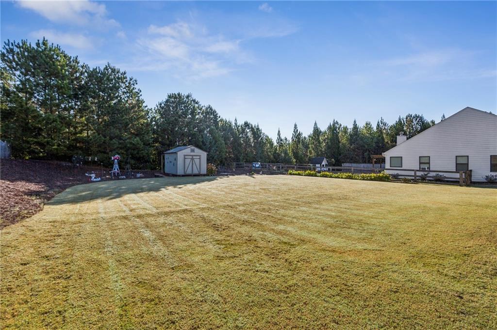312 Upper Pheasant Court Ball Ground, GA 30107 - Photo 3 of 19 a house view with swimming pool in front of the house