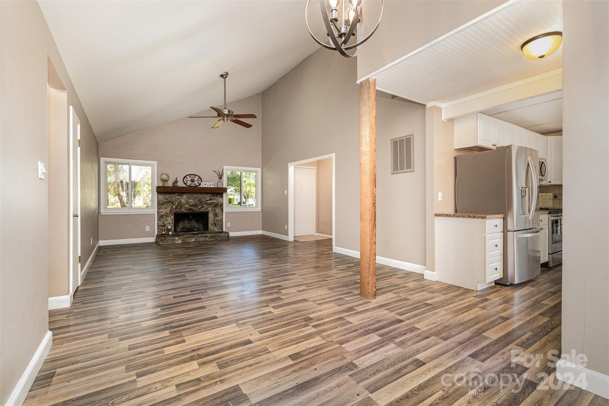 1316 Reid Harkey Road Matthews, NC 28105 - Photo 12 of 35 a view of living room with furniture and wooden floor