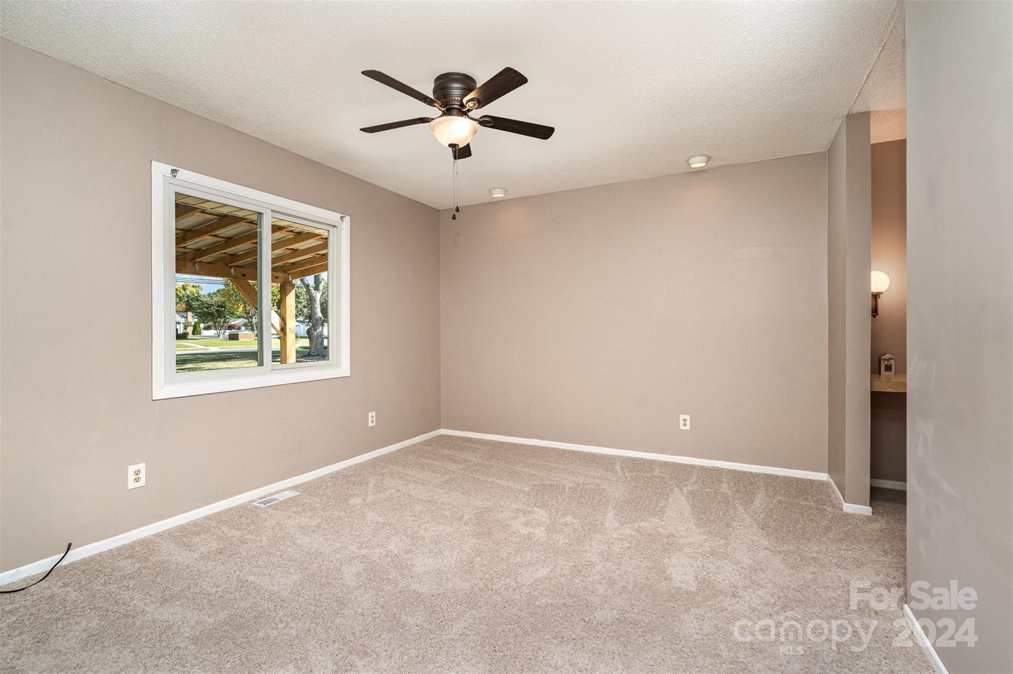1316 Reid Harkey Road Matthews, NC 28105 - Photo 17 of 35 an empty room with windows and closet