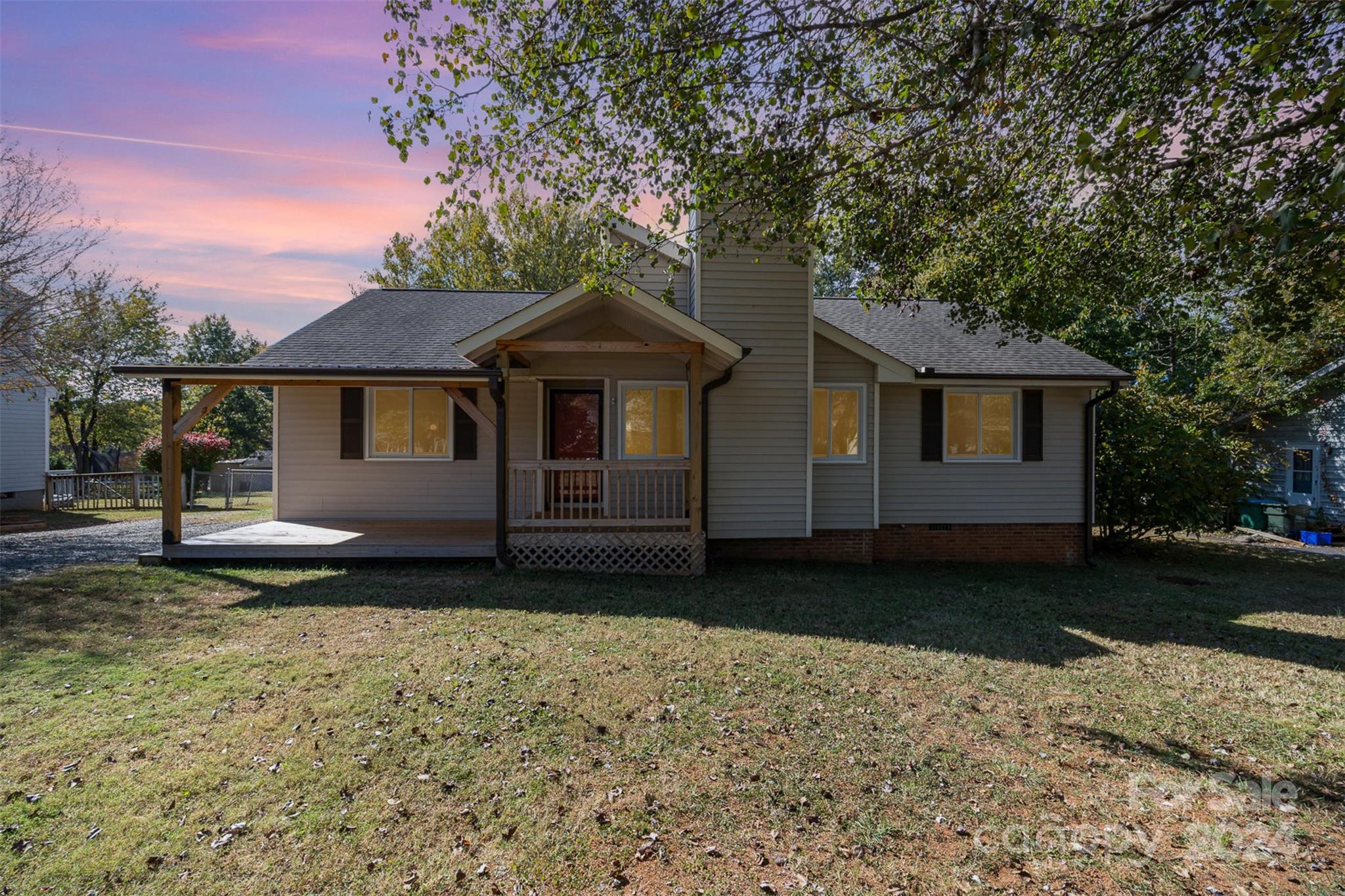 1316 Reid Harkey Road Matthews, NC 28105 - Photo 30 of 35 a front view of a house with a garden