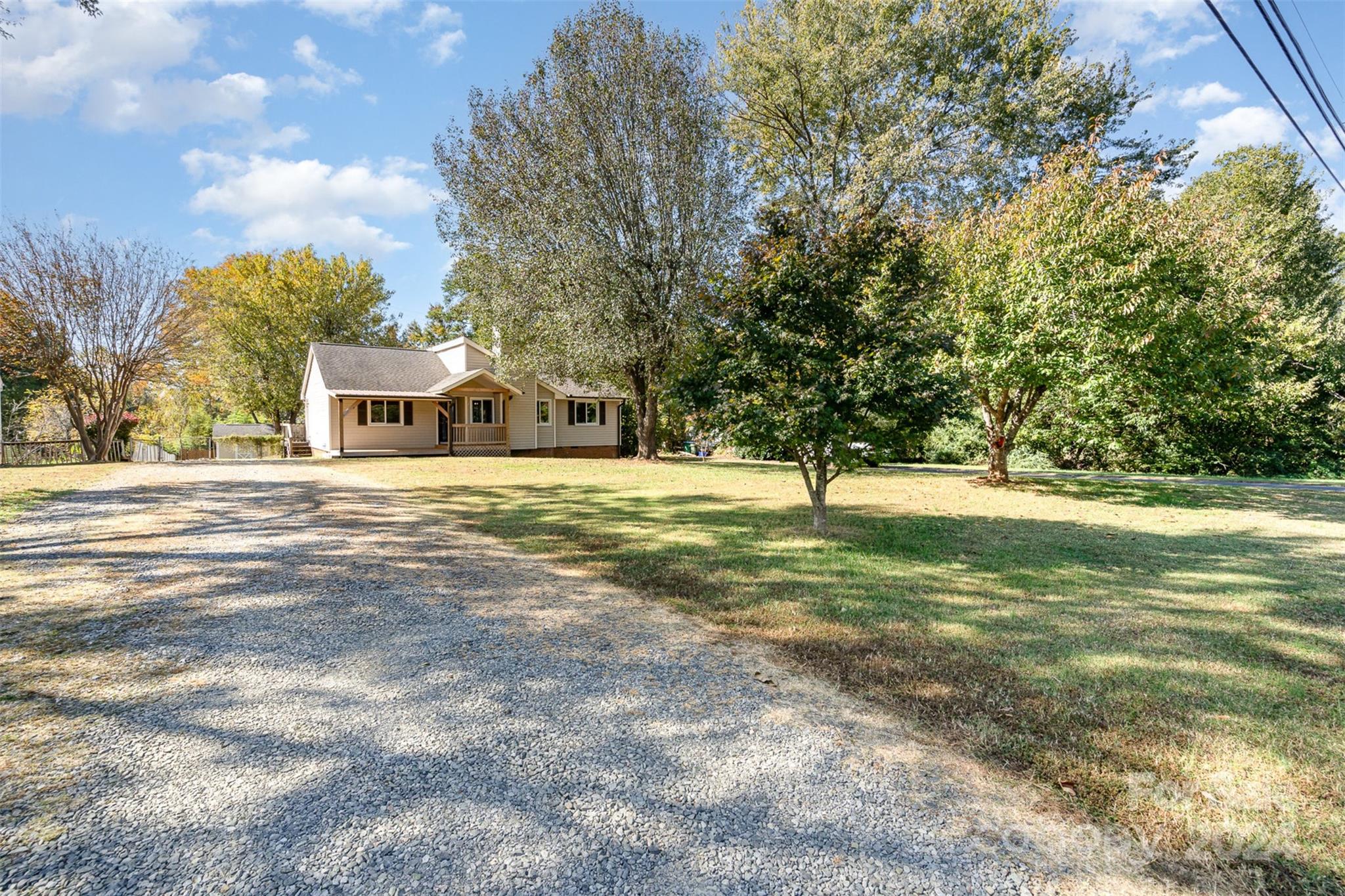 1316 Reid Harkey Road Matthews, NC 28105 - Photo 3 of 35 a view of a house with a yard