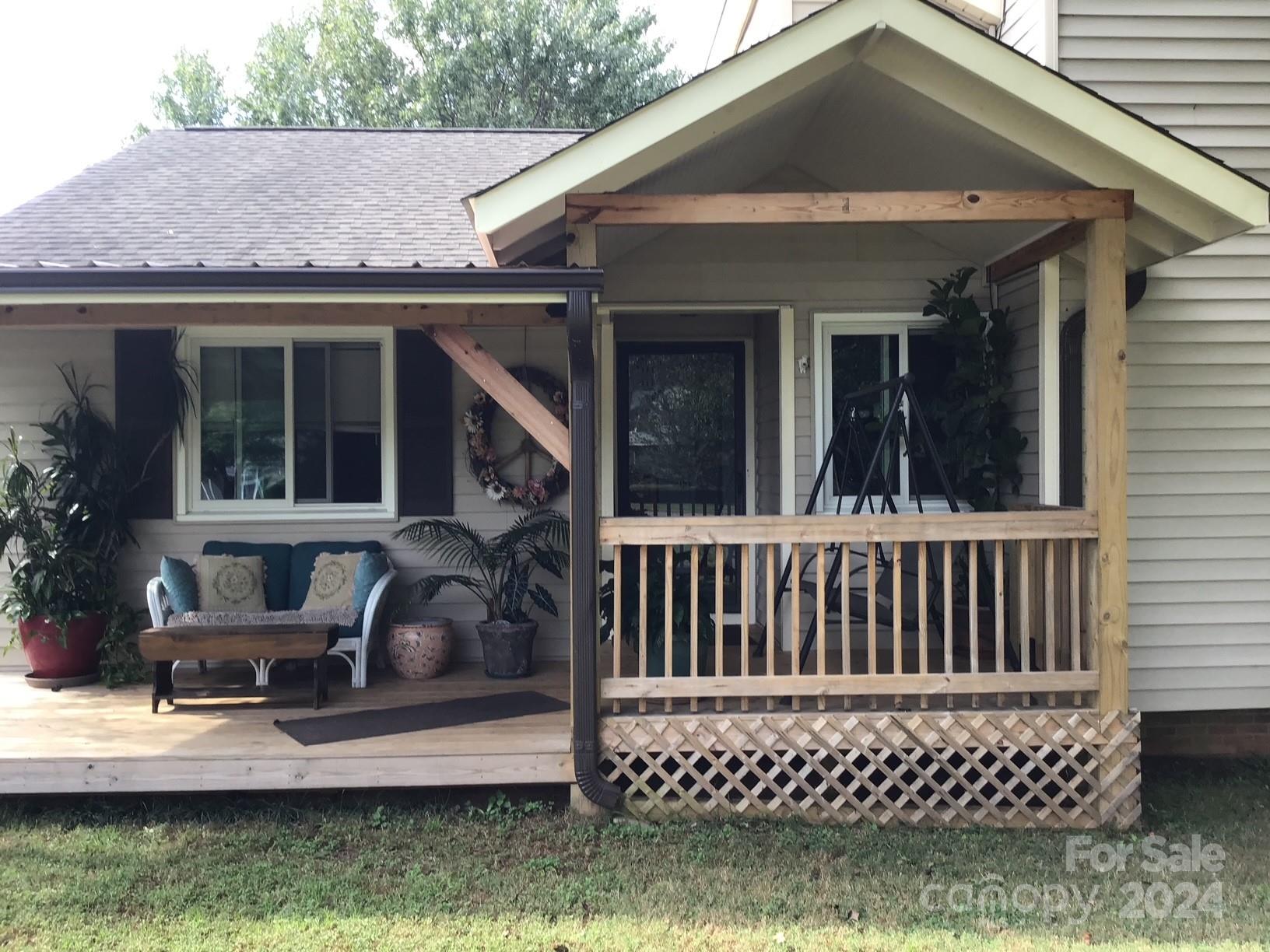 1316 Reid Harkey Road Matthews, NC 28105 - Photo 33 of 35 a view of a house with wooden deck