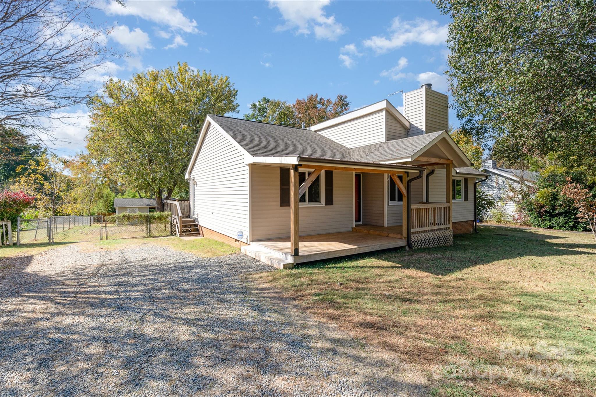 1316 Reid Harkey Road Matthews, NC 28105 - Photo 4 of 35 a house that has a tree in front of it