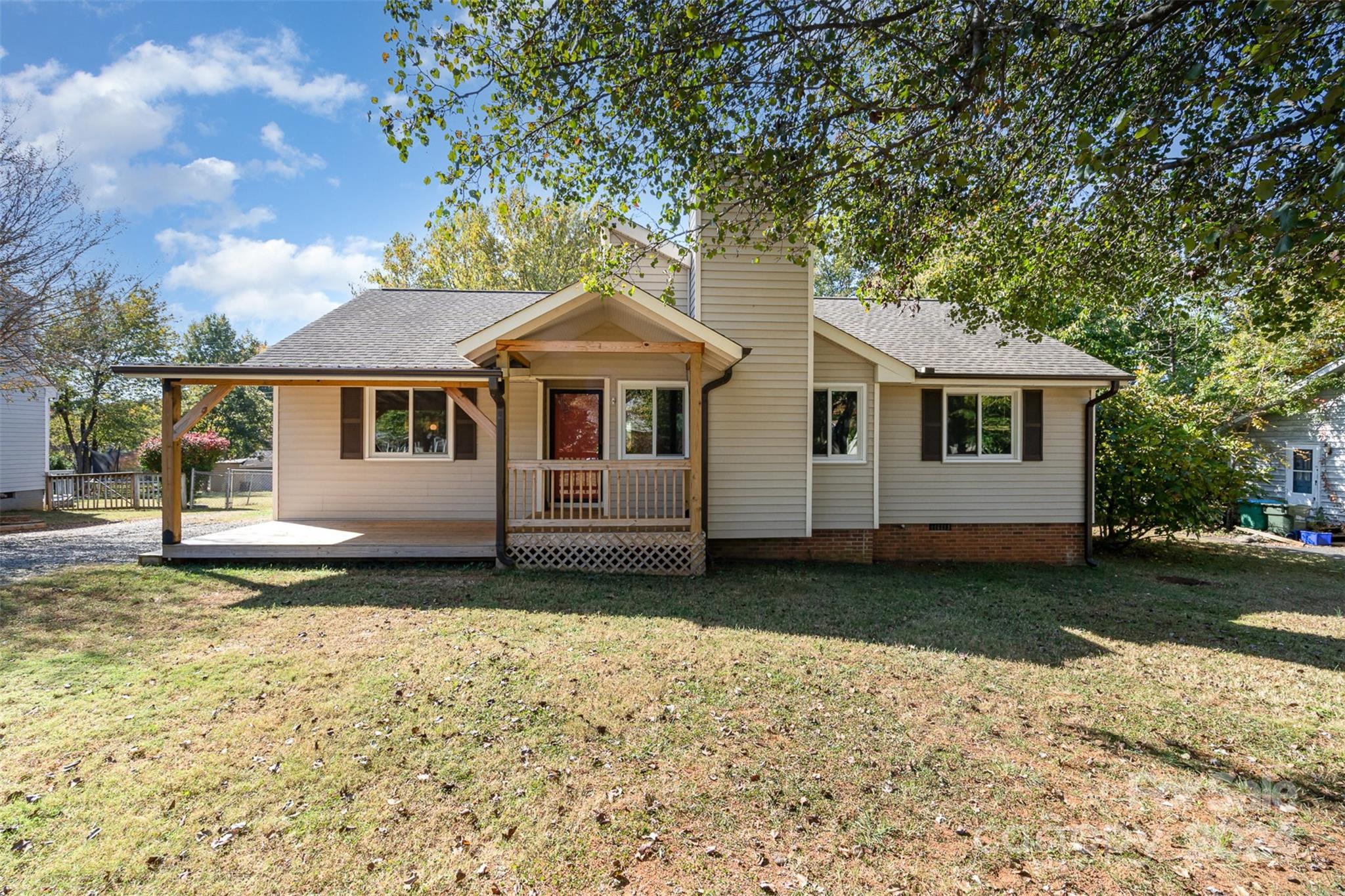 1316 Reid Harkey Road Matthews, NC 28105 - Photo 5 of 35 a white house that has a tree in front of it