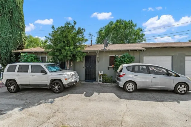 a car parked in front of a house
