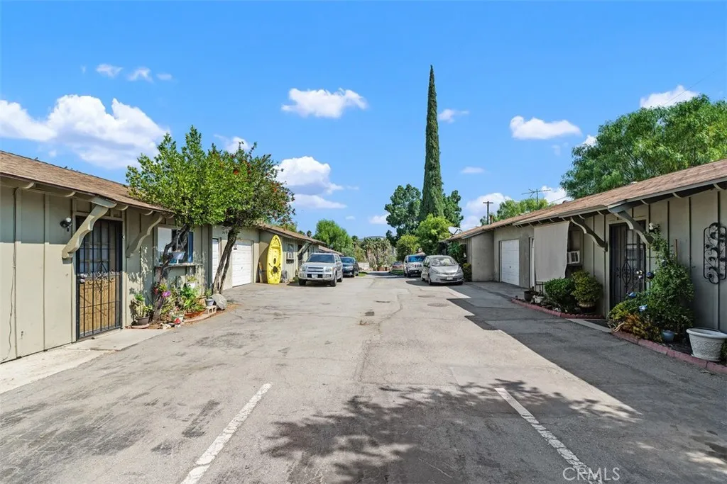 7979 Minnesota Road Corona, CA 92881 - Photo 9 of 9 a view of a house with a yard and potted plants