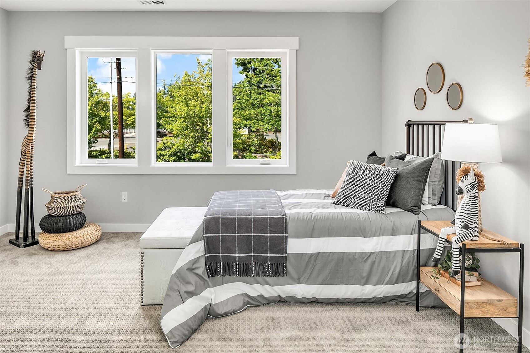 7528 215th Street Southwest, Unit 101 Edmonds, WA 98026 - Photo 15 of 29 a bedroom with a bed and a chair