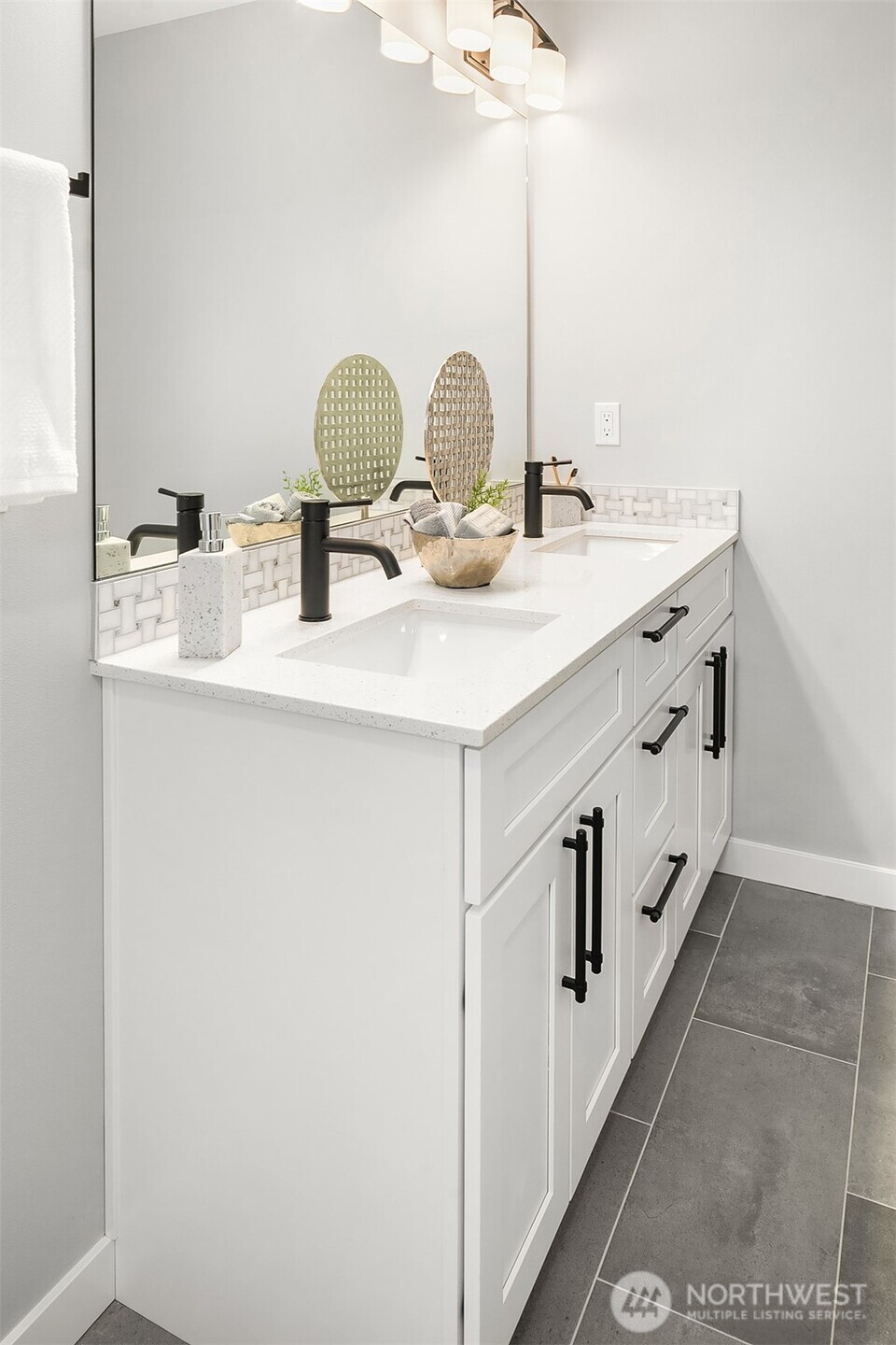 7528 215th Street Southwest, Unit 101 Edmonds, WA 98026 - Photo 20 of 29 a bathroom with double sink and a mirror