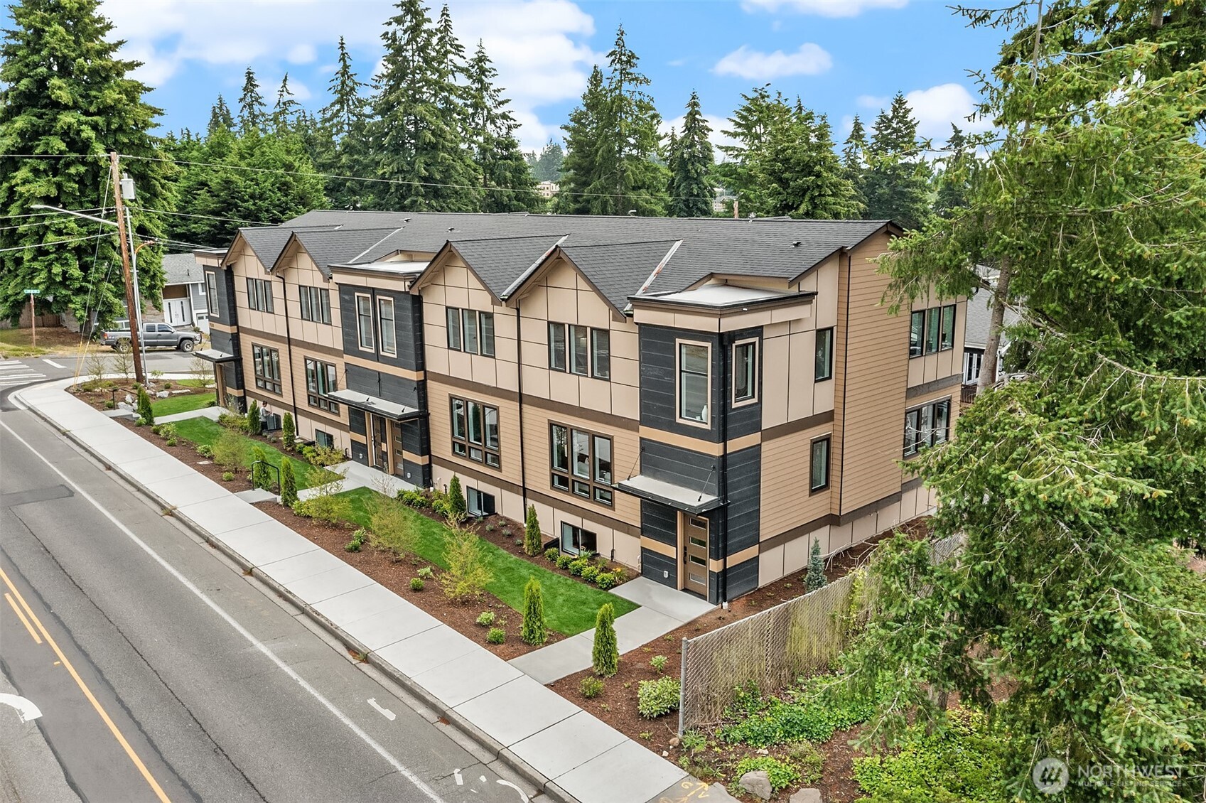 7528 215th Street Southwest, Unit 101 Edmonds, WA 98026 - Photo 2 of 29 an aerial view of a house with balcony