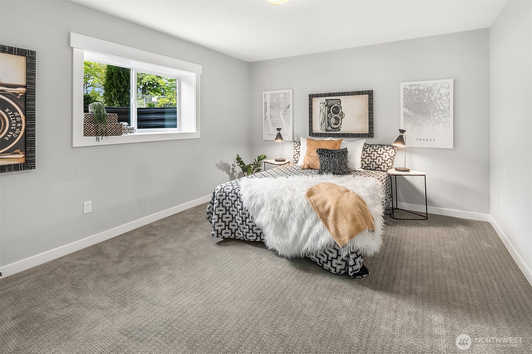 7528 215th Street Southwest, Unit 101 Edmonds, WA 98026 - Photo 22 of 29 a spacious bedroom with a bed and wooden floor