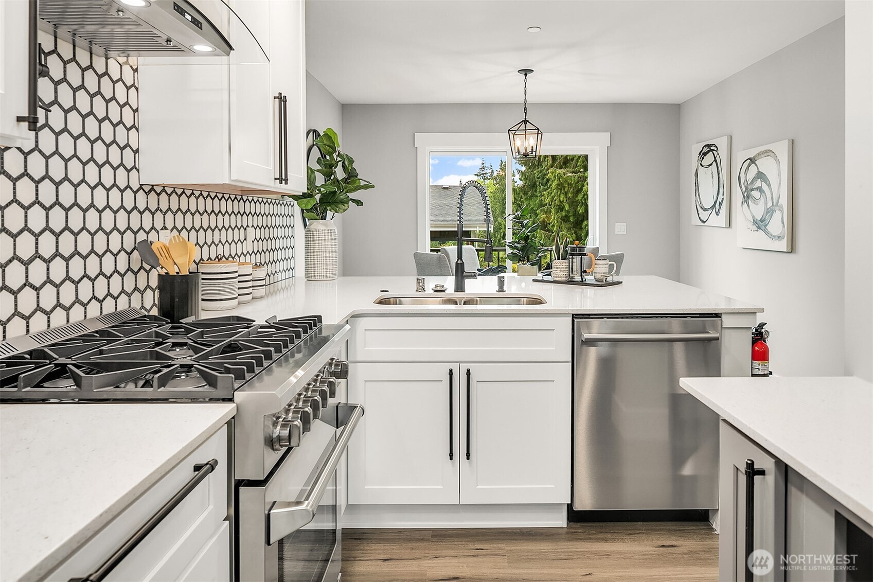 7528 215th Street Southwest, Unit 101 Edmonds, WA 98026 - Photo 7 of 29 a kitchen with a sink stove and cabinets