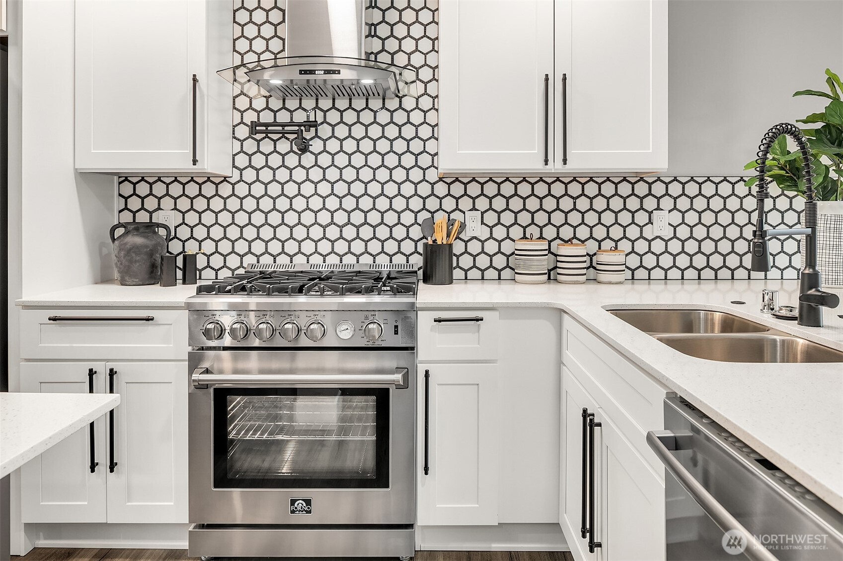 7528 215th Street Southwest, Unit 101 Edmonds, WA 98026 - Photo 8 of 29 a stove top oven sitting inside of a kitchen