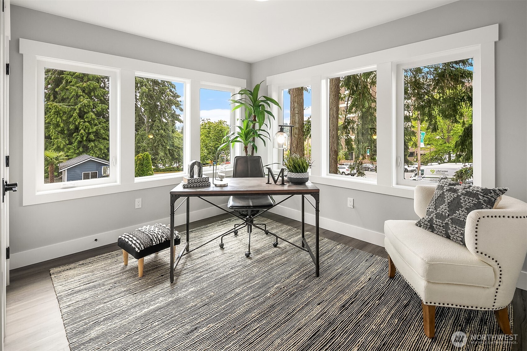 7528 215th Street Southwest, Unit 101 Edmonds, WA 98026 - Photo 9 of 29 a living room with furniture and a wooden floor