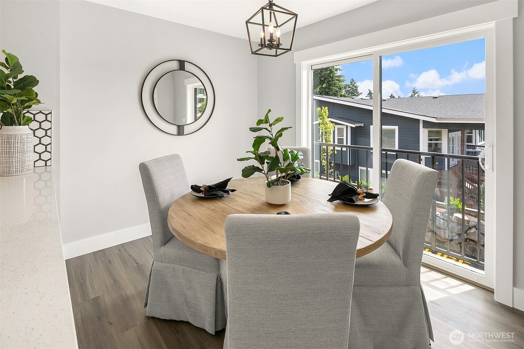 7528 215th Street Southwest, Unit 101 Edmonds, WA 98026 - Photo 10 of 29 a dining room with furniture and garden view