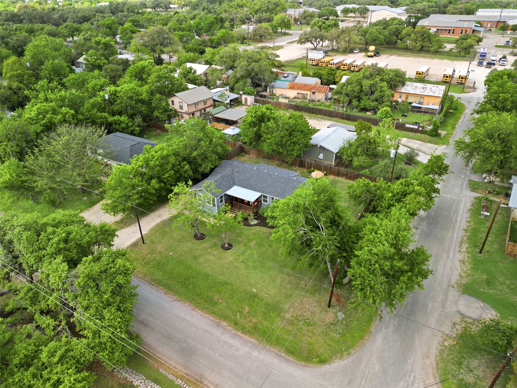700 9th Street Blanco, TX 78606 - Photo 24 of 33 an aerial view of residential houses with outdoor space and trees