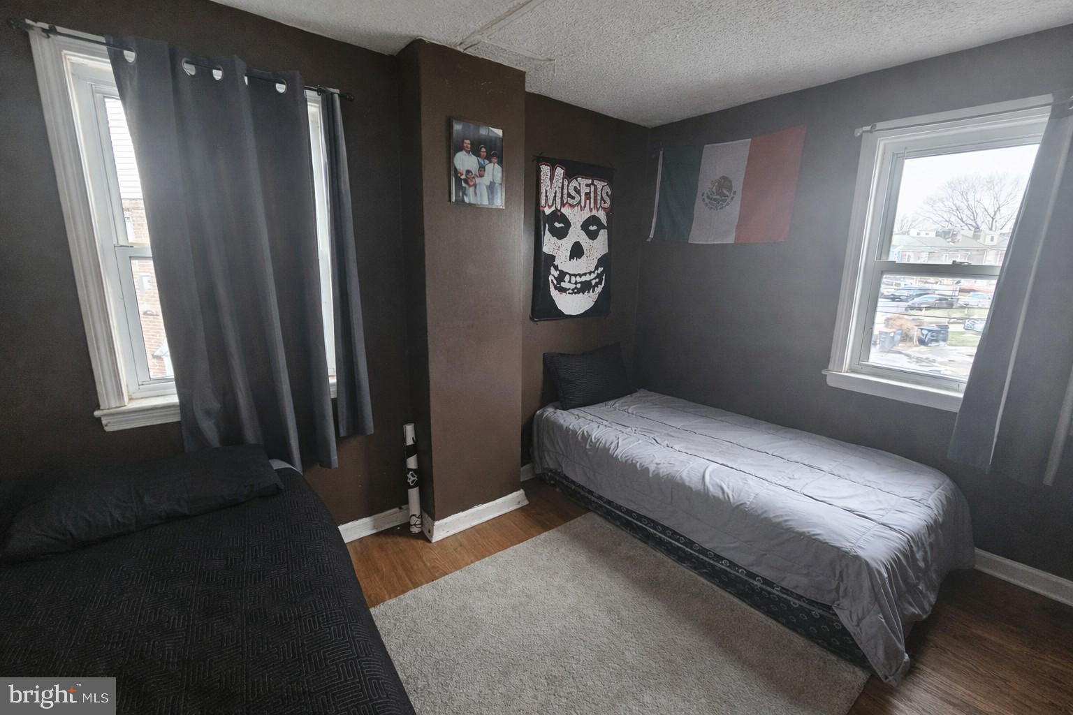 1438 Perkins Street Chester, PA 19013 - Photo 5 of 10 a bedroom with a bed and a window