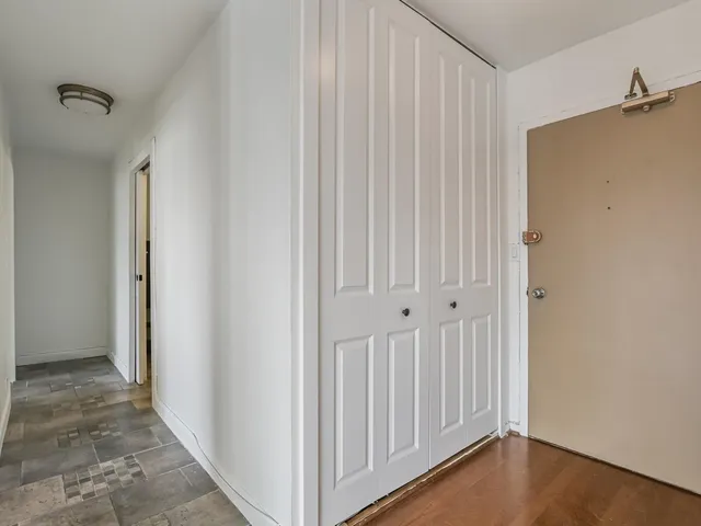a view of a livingroom with wooden floor