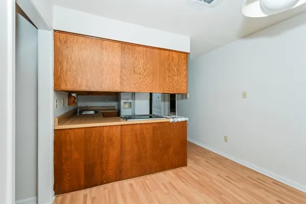 a room with wooden floor and a table