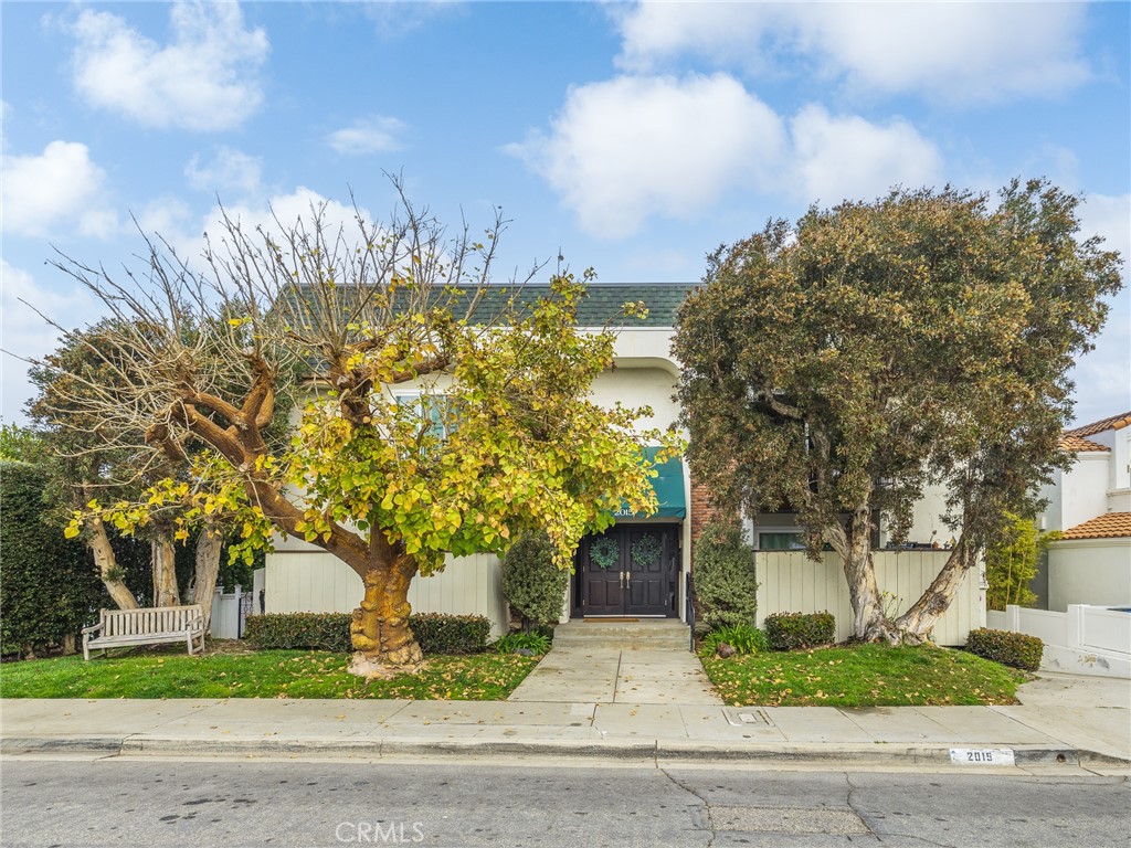 2015 Bataan Road, Unit 105 Redondo Beach, CA 90278 - Photo 1 of 29 a front view of a house with garden