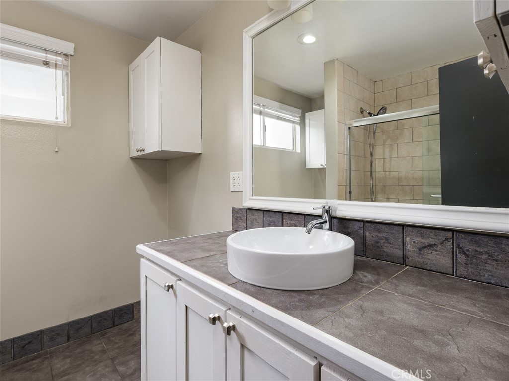 2015 Bataan Road, Unit 105 Redondo Beach, CA 90278 - Photo 19 of 29 a bathroom with a sink and a mirror