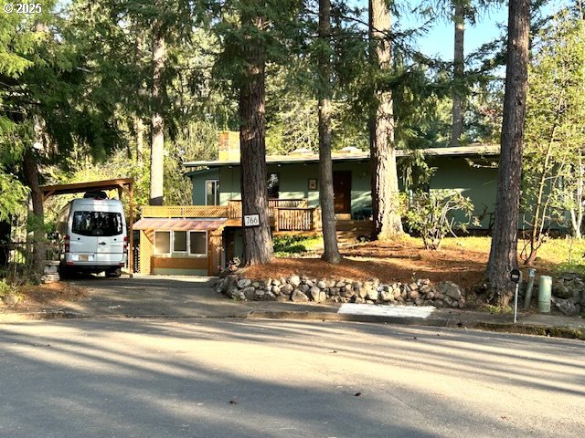 a view of a house with a large tree