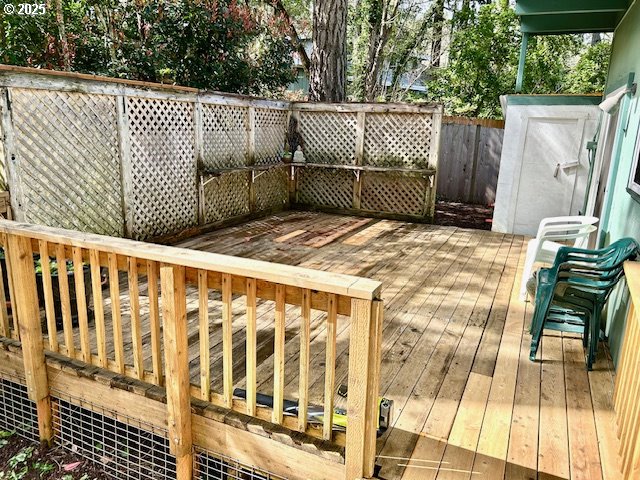 766 Foothill Drive Eugene, OR 97405 - Photo 12 of 12 a backyard of a house with a floor to ceiling window and wooden fence