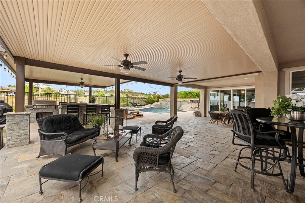 13734 Sweet Avenue Riverside, CA 92503 - Photo 51 of 75 Photo showing how large the Patio cover is and the slate deck allowing plenty of room for a great Pool Party.