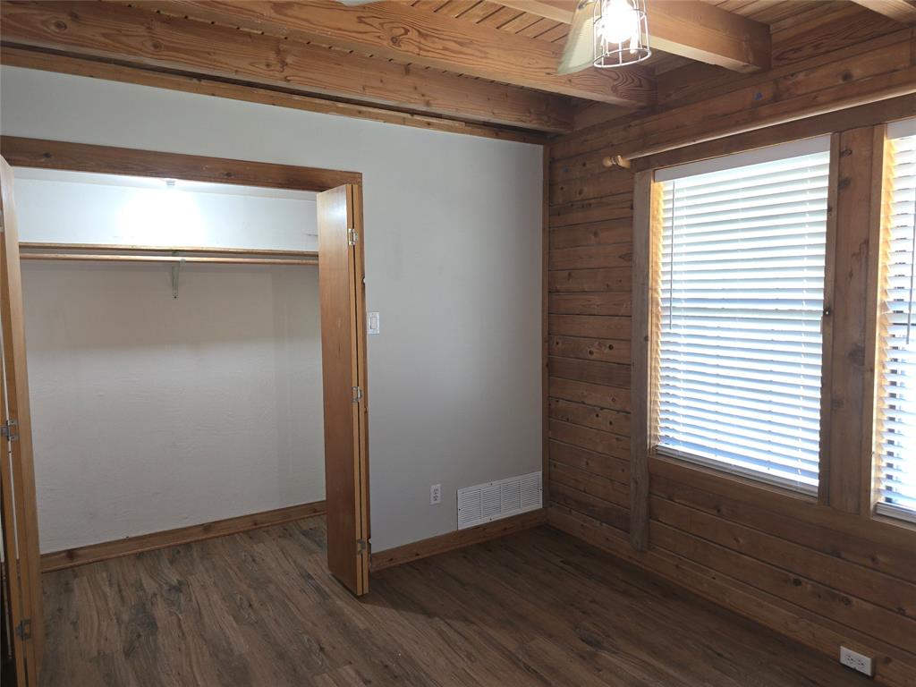 3505 Farmer Road Azle, TX 76020 - Photo 19 of 40 Plenty of space in this lighted closet, located in the front bedroom downstairs.