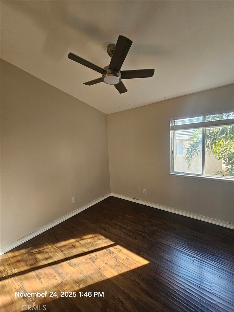 7367 Belpine Place Rancho Cucamonga, CA 91730 - Photo 12 of 15 a view of empty room with wooden floor and fan