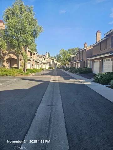a view of a street with a building in the background