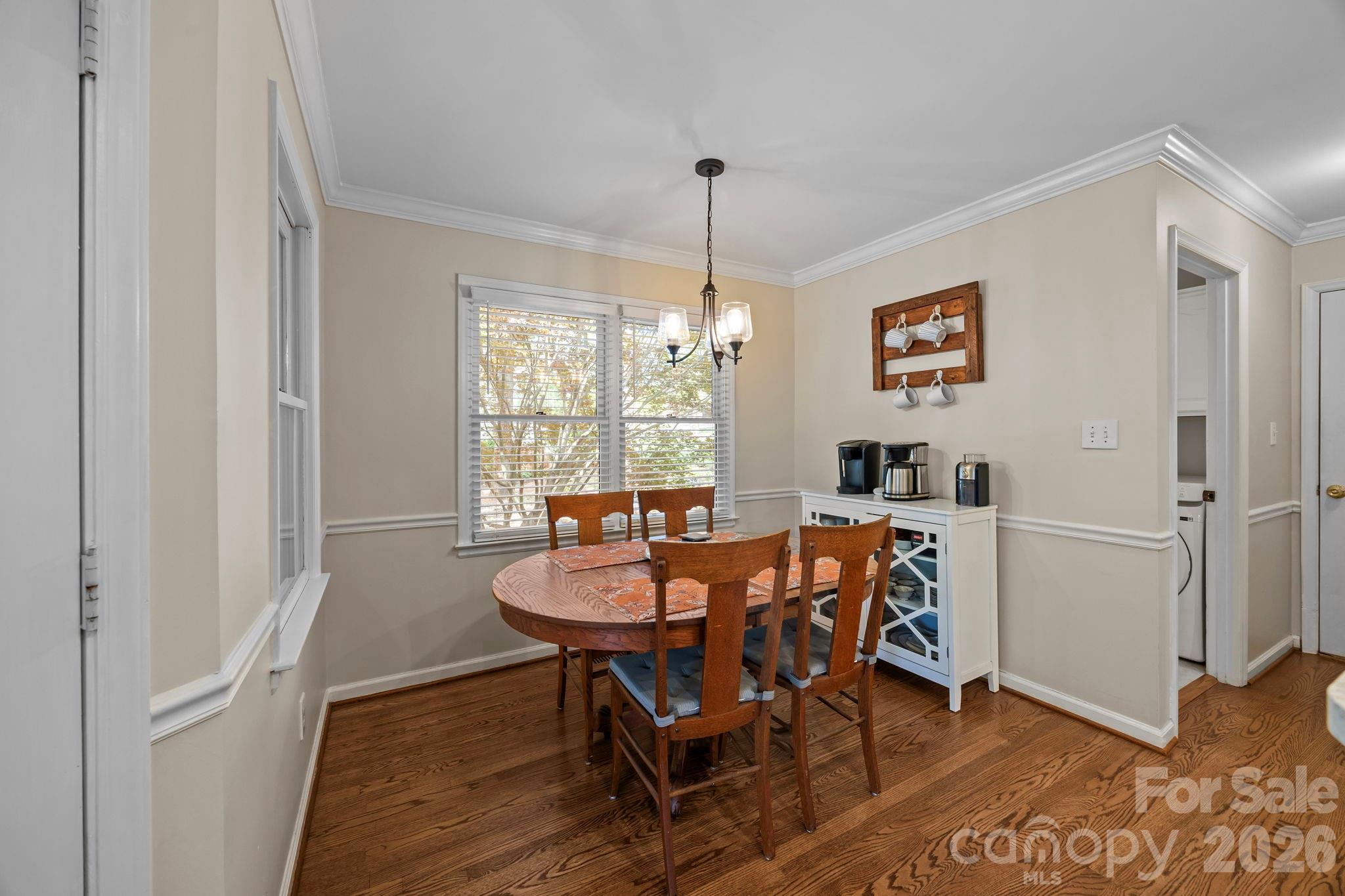 413 Nixon Road Belmont, NC 28012 - Photo 18 of 48 a view of a dining room with furniture window and wooden floor