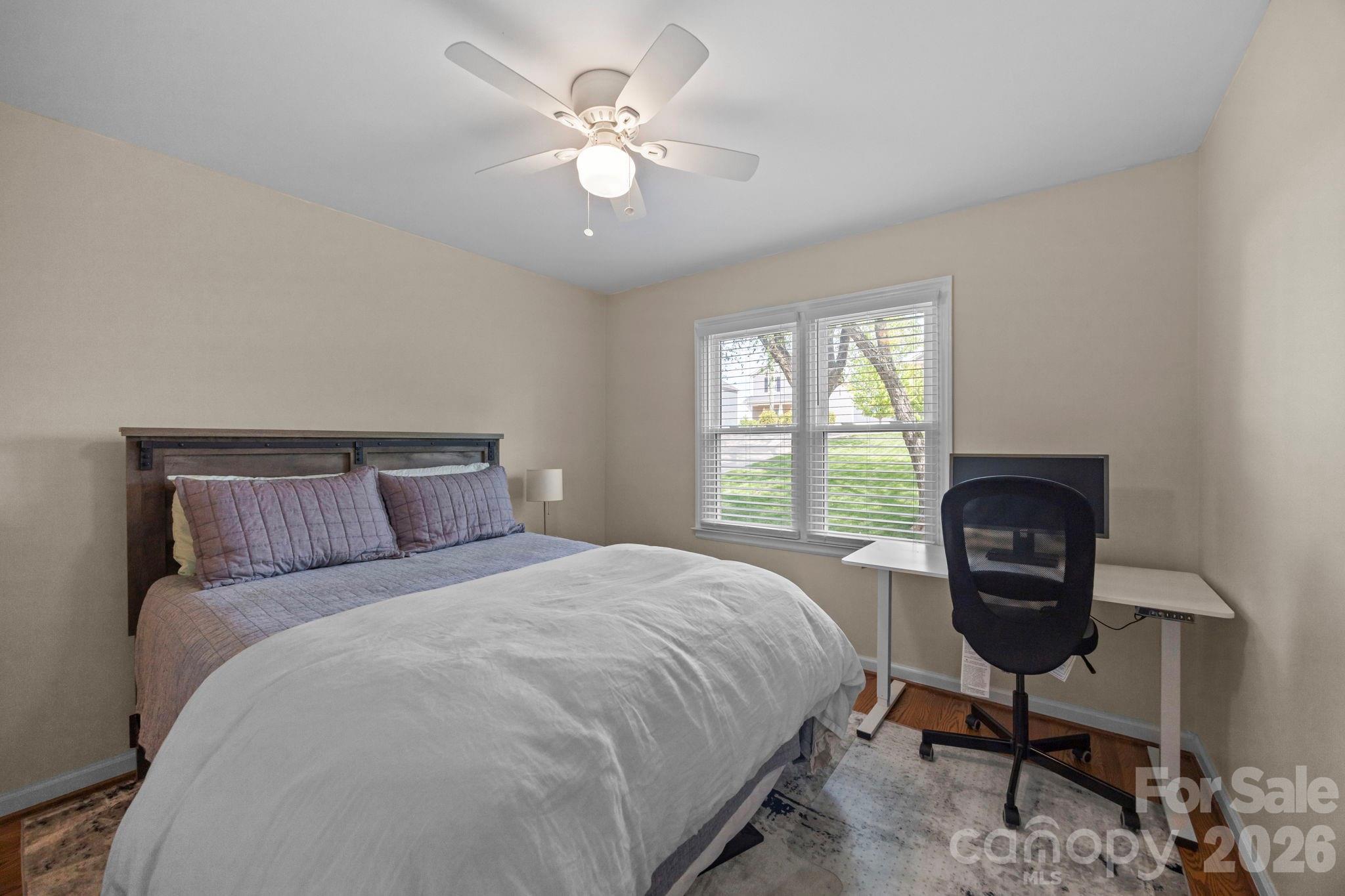413 Nixon Road Belmont, NC 28012 - Photo 22 of 48 a bedroom with a bed a table and chair