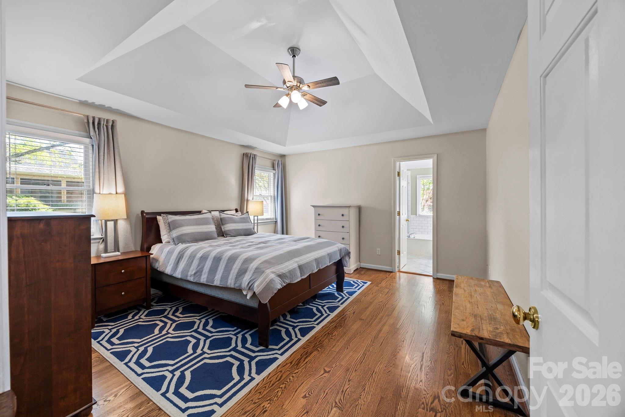 413 Nixon Road Belmont, NC 28012 - Photo 25 of 48 a bedroom with a bed and wooden floor