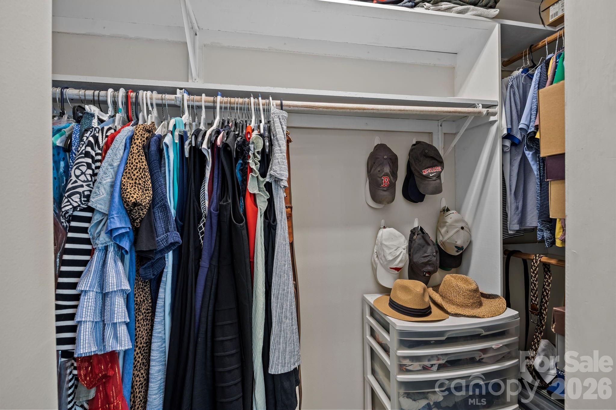 413 Nixon Road Belmont, NC 28012 - Photo 29 of 48 a view of walk in closet with clothes and shoes