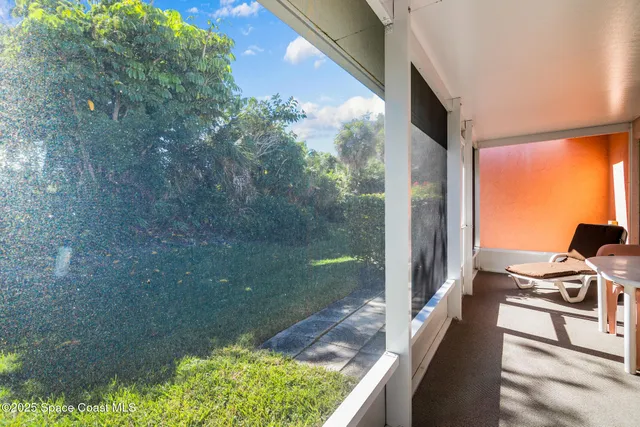 a backyard of a house with a fountain