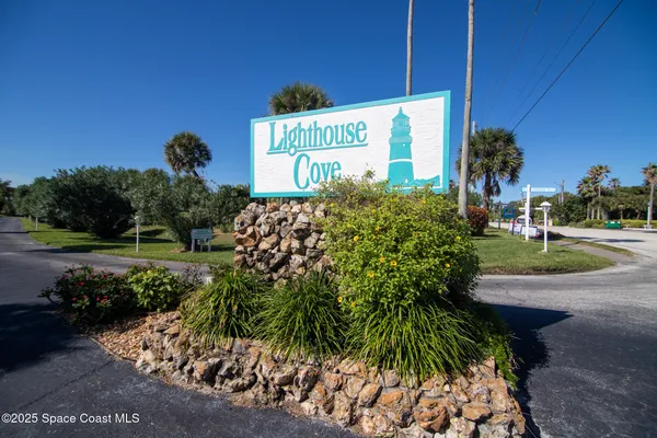 a sign that is sitting in front of a house