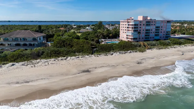 a view of a large building with a beach