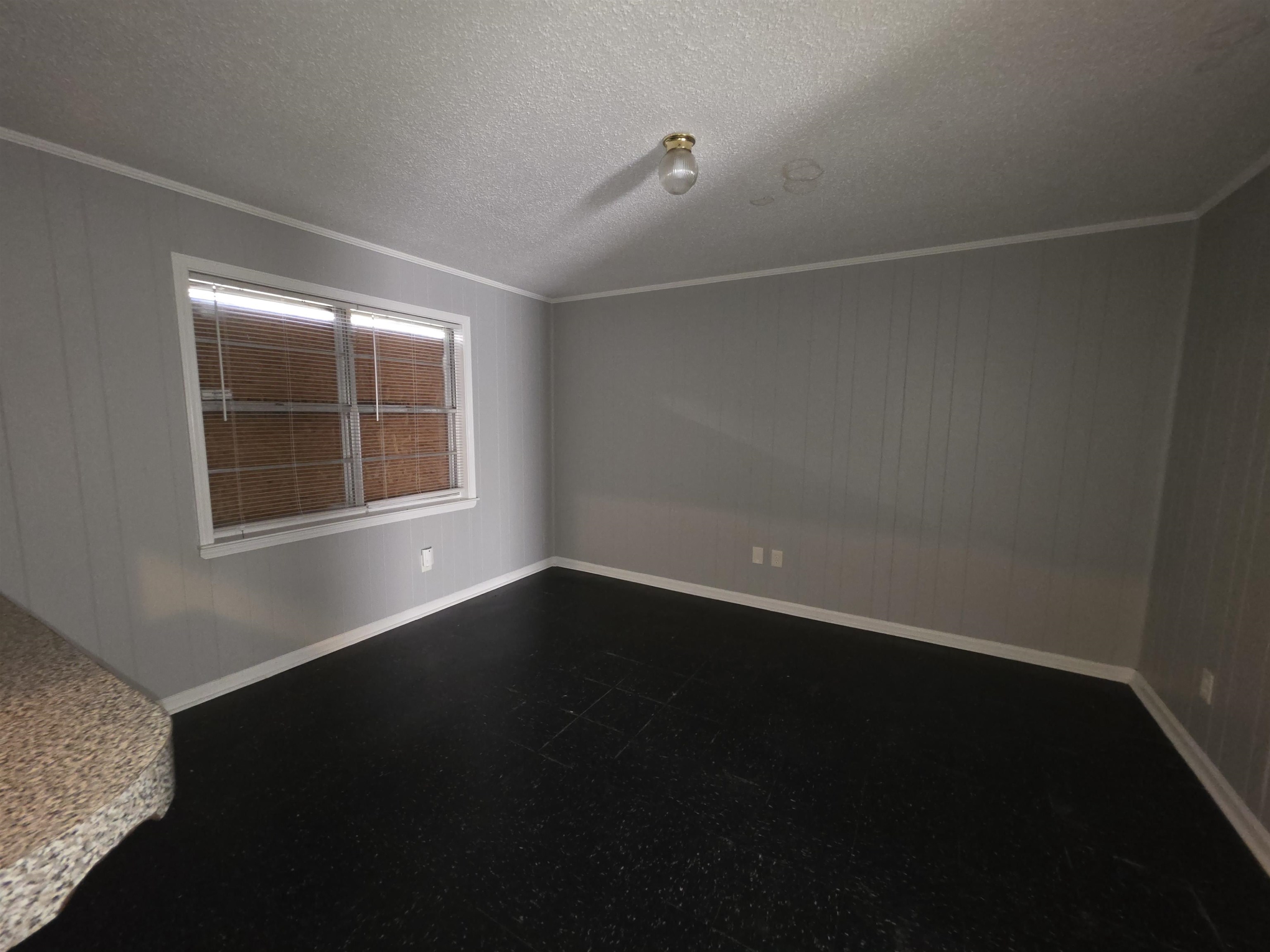 936 Chesterton Drive Memphis, TN 38127 - Photo 12 of 28 a view of an empty room with wooden floor and a window