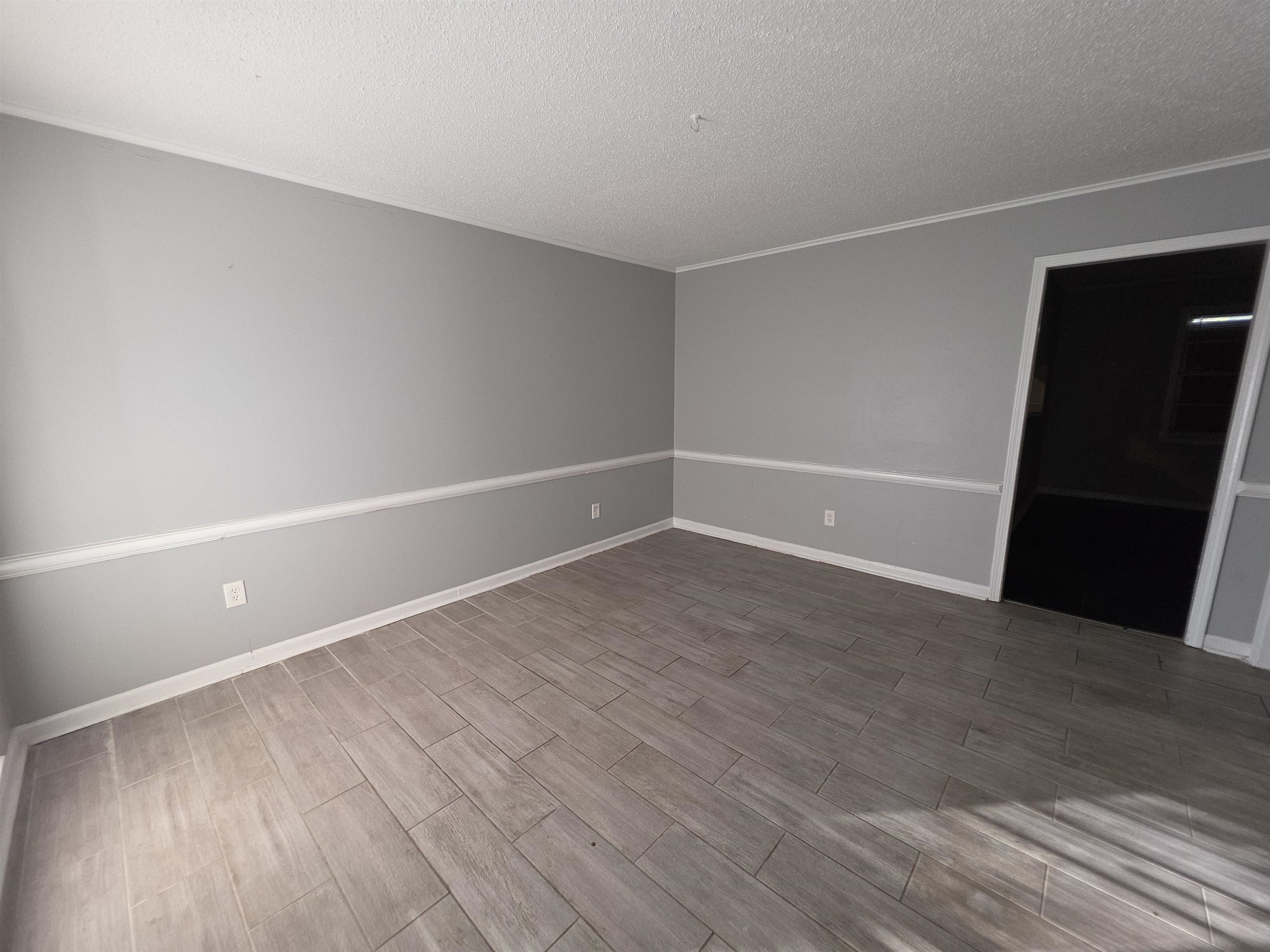 936 Chesterton Drive Memphis, TN 38127 - Photo 15 of 28 a view of an empty room with wooden floor