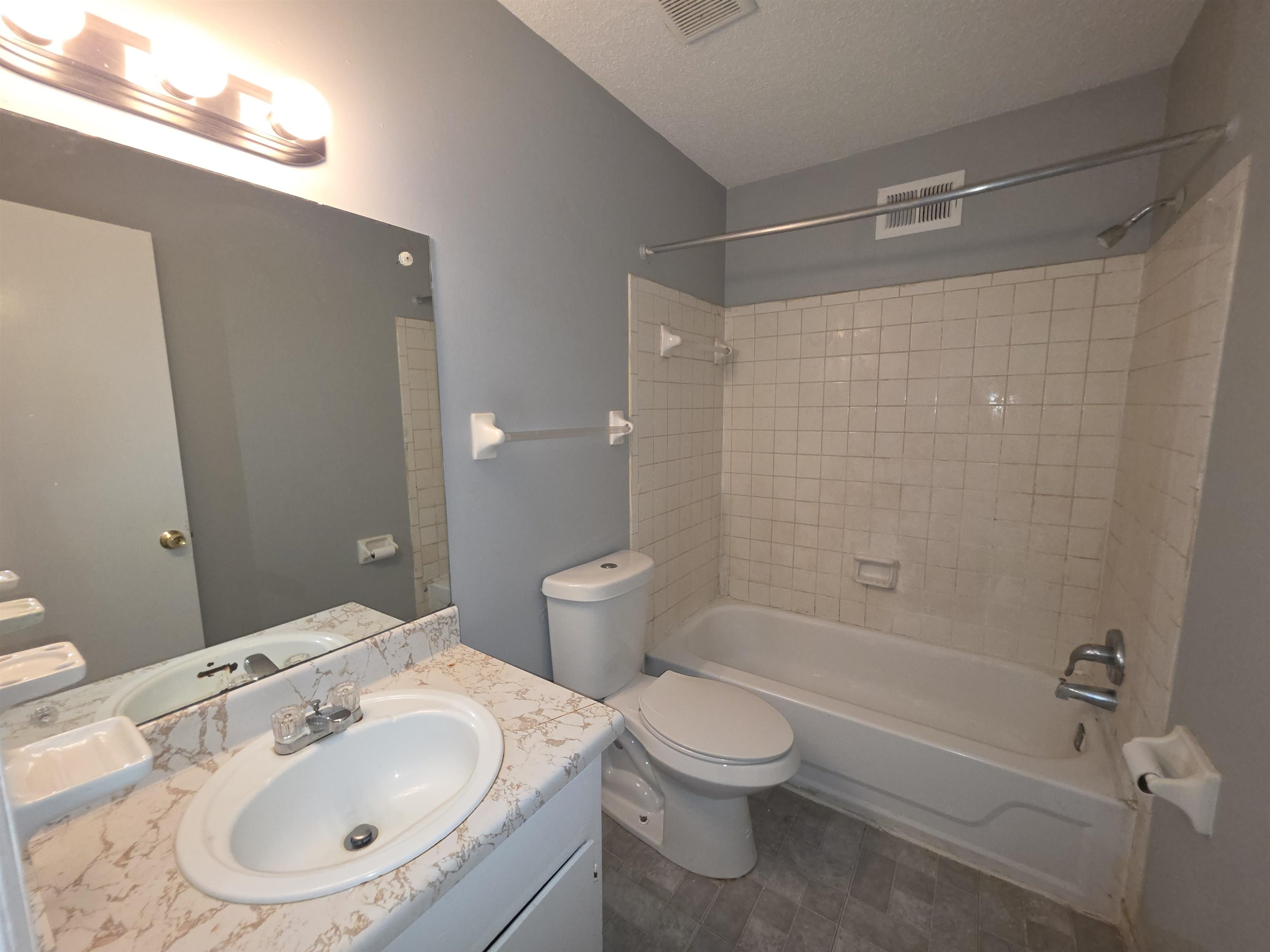 936 Chesterton Drive Memphis, TN 38127 - Photo 17 of 28 a bathroom with a sink toilet and shower