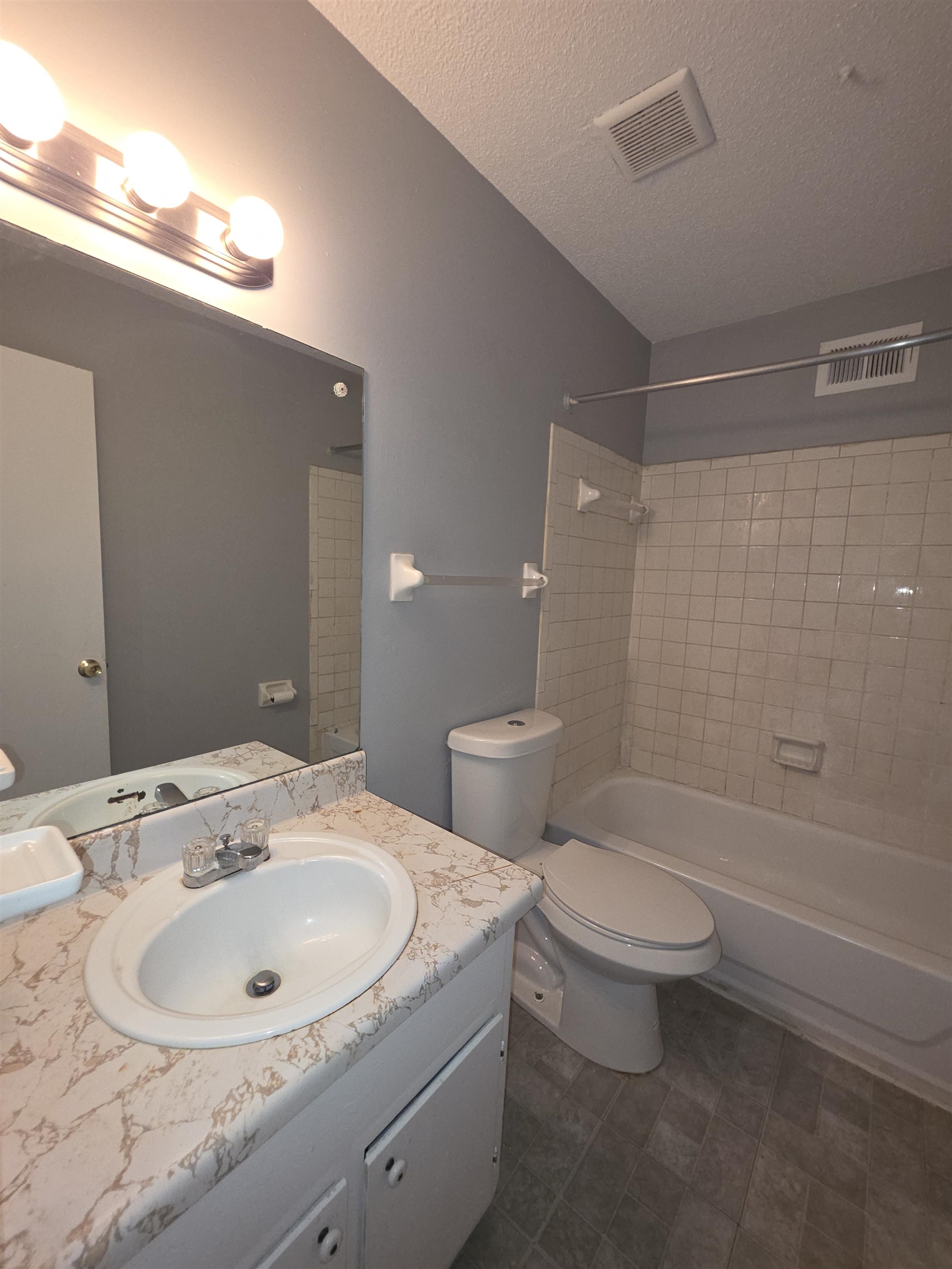 936 Chesterton Drive Memphis, TN 38127 - Photo 18 of 28 a bathroom with a sink a toilet and shower