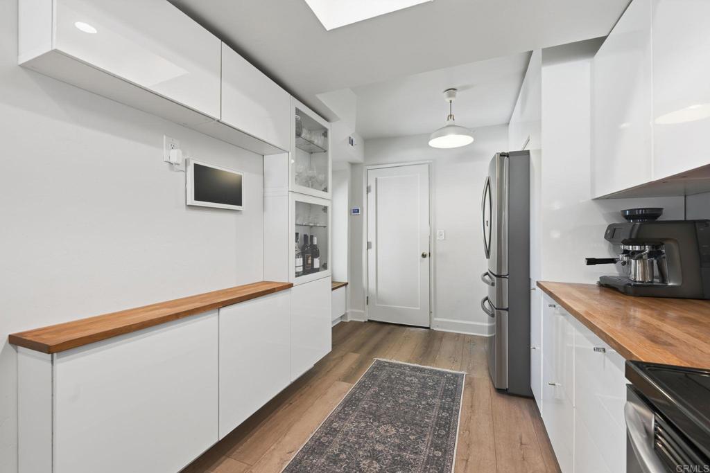 2972 Lancaster Road Carlsbad, CA 92010 - Photo 12 of 36 a bathroom with a sink a mirror and a shower