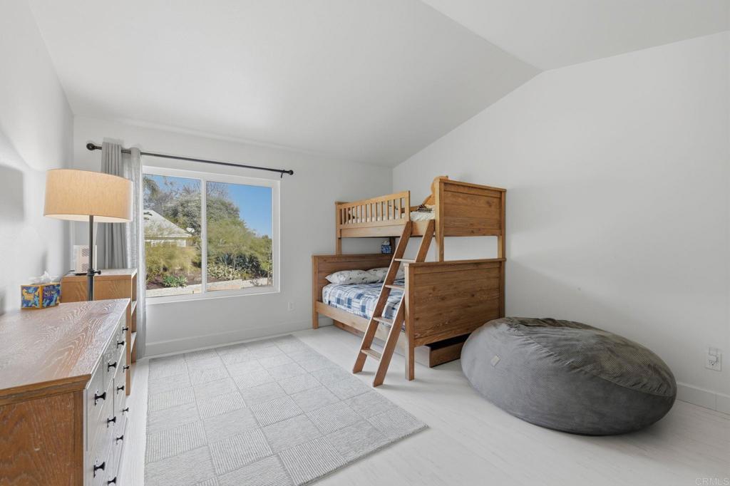 2972 Lancaster Road Carlsbad, CA 92010 - Photo 17 of 36 a bedroom with a bed and a window