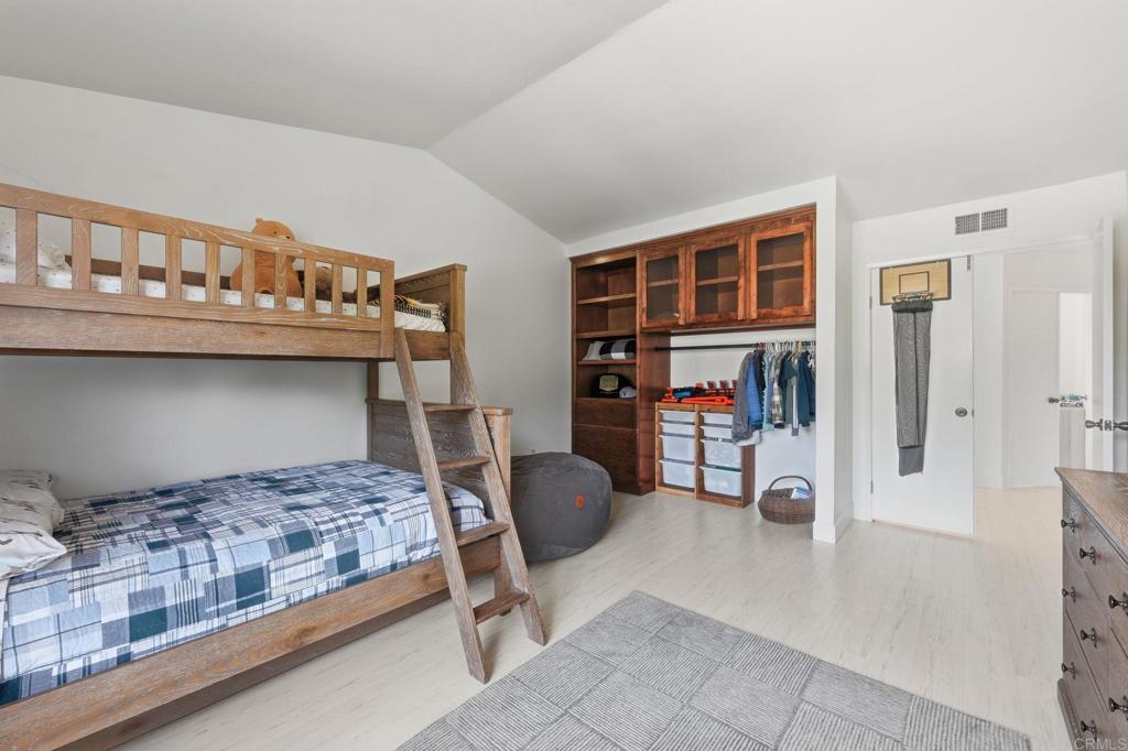 2972 Lancaster Road Carlsbad, CA 92010 - Photo 18 of 36 a bedroom with a bed and a walk in closet