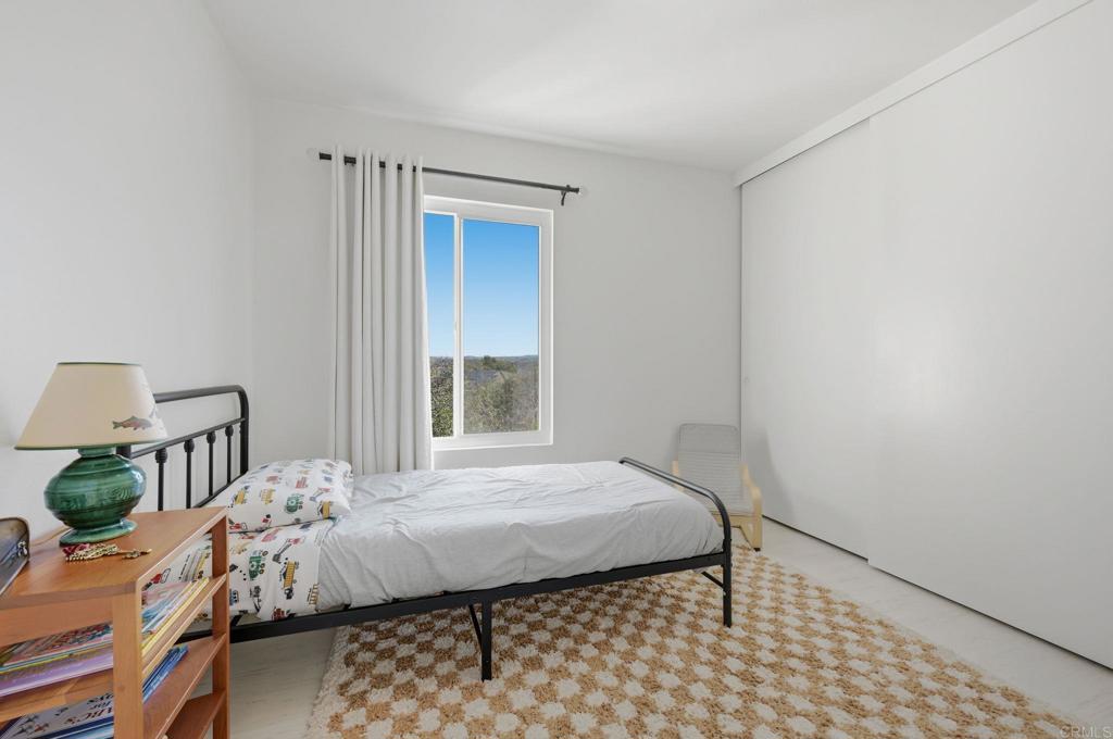 2972 Lancaster Road Carlsbad, CA 92010 - Photo 20 of 36 a bedroom with a bed and a window