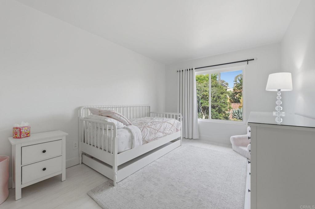 2972 Lancaster Road Carlsbad, CA 92010 - Photo 21 of 36 a spacious bedroom with a bed and a window