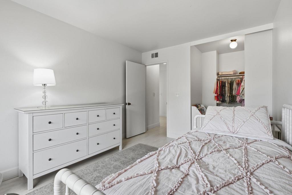 2972 Lancaster Road Carlsbad, CA 92010 - Photo 22 of 36 a bedroom with a bed and a dresser