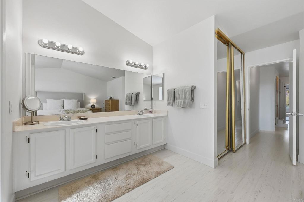 2972 Lancaster Road Carlsbad, CA 92010 - Photo 26 of 36 a spacious bathroom with a double vanity sink and mirror